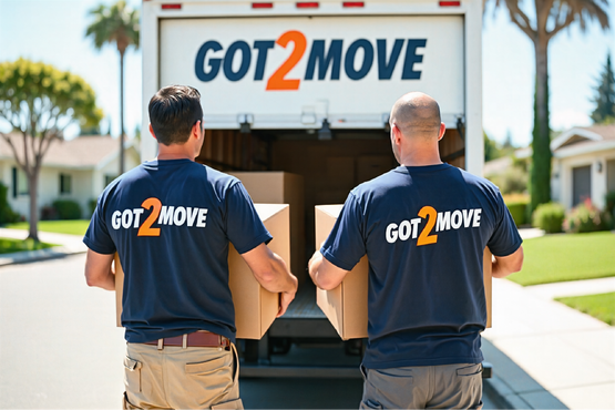 two movers carrying boxes into a moving van in Burlingame